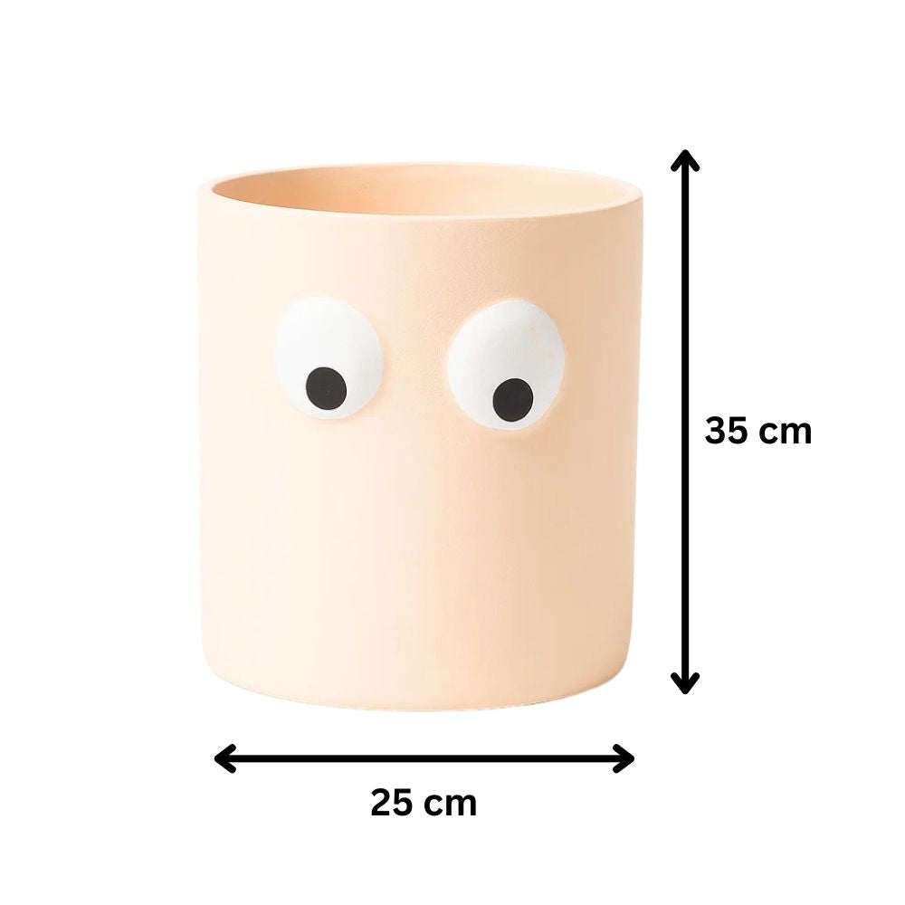 Face of Green Ceramic Planter With Playful Eye Design