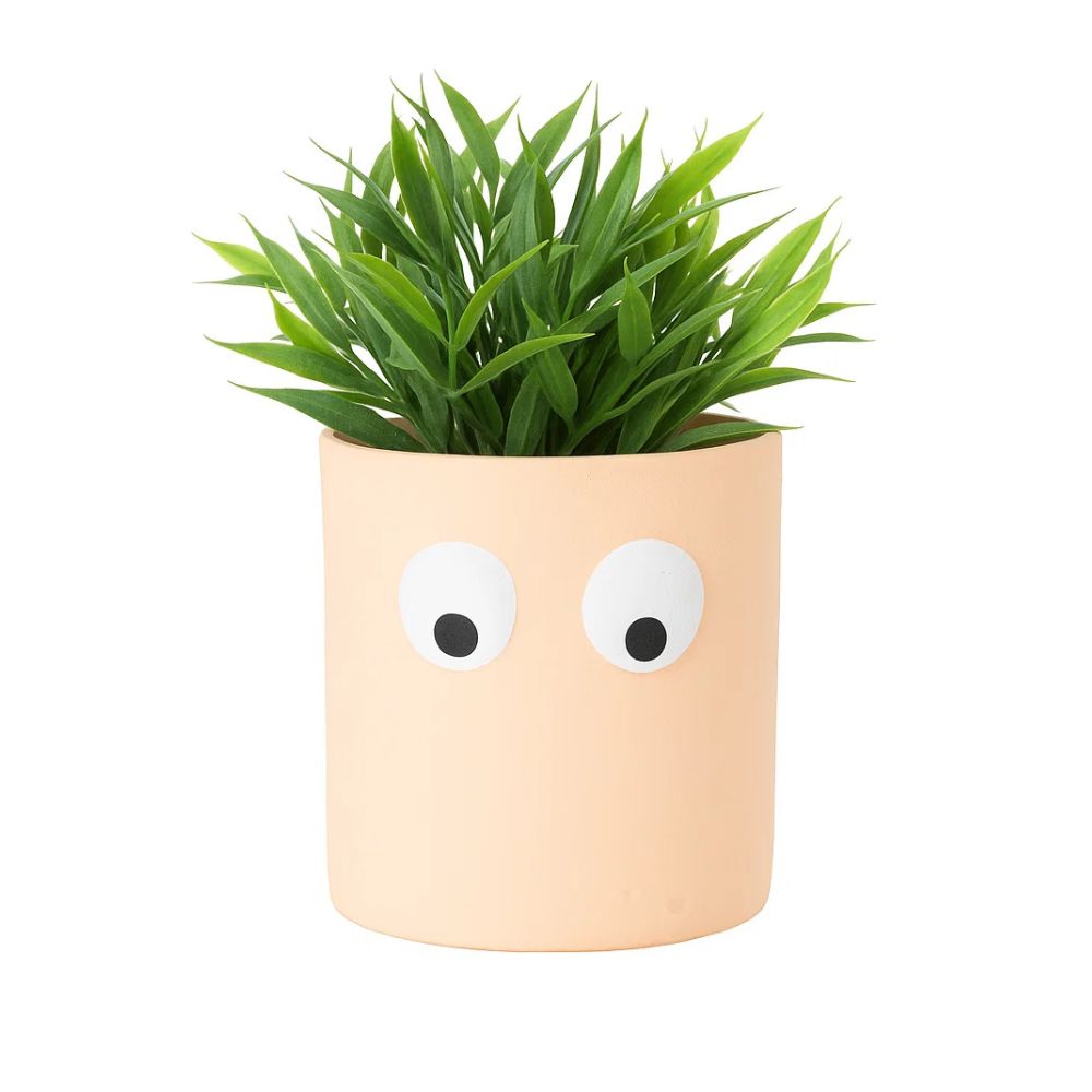 Face of Green Ceramic Planter With Playful Eye Design