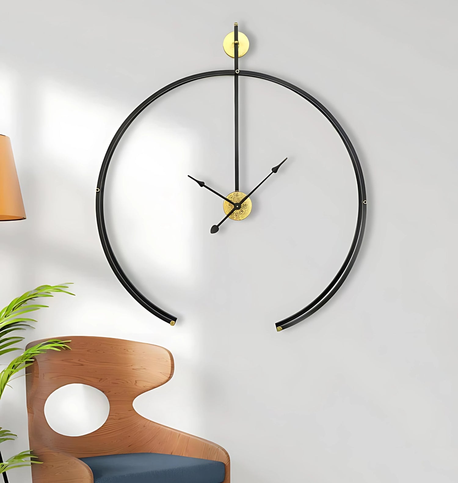 Black Metal Analog Wall Clock With Golden Centre Adding Modern Elegance