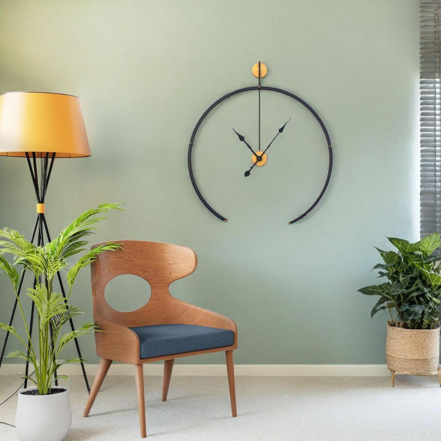 Black Metal Analog Wall Clock With Golden Centre Adding Modern Elegance