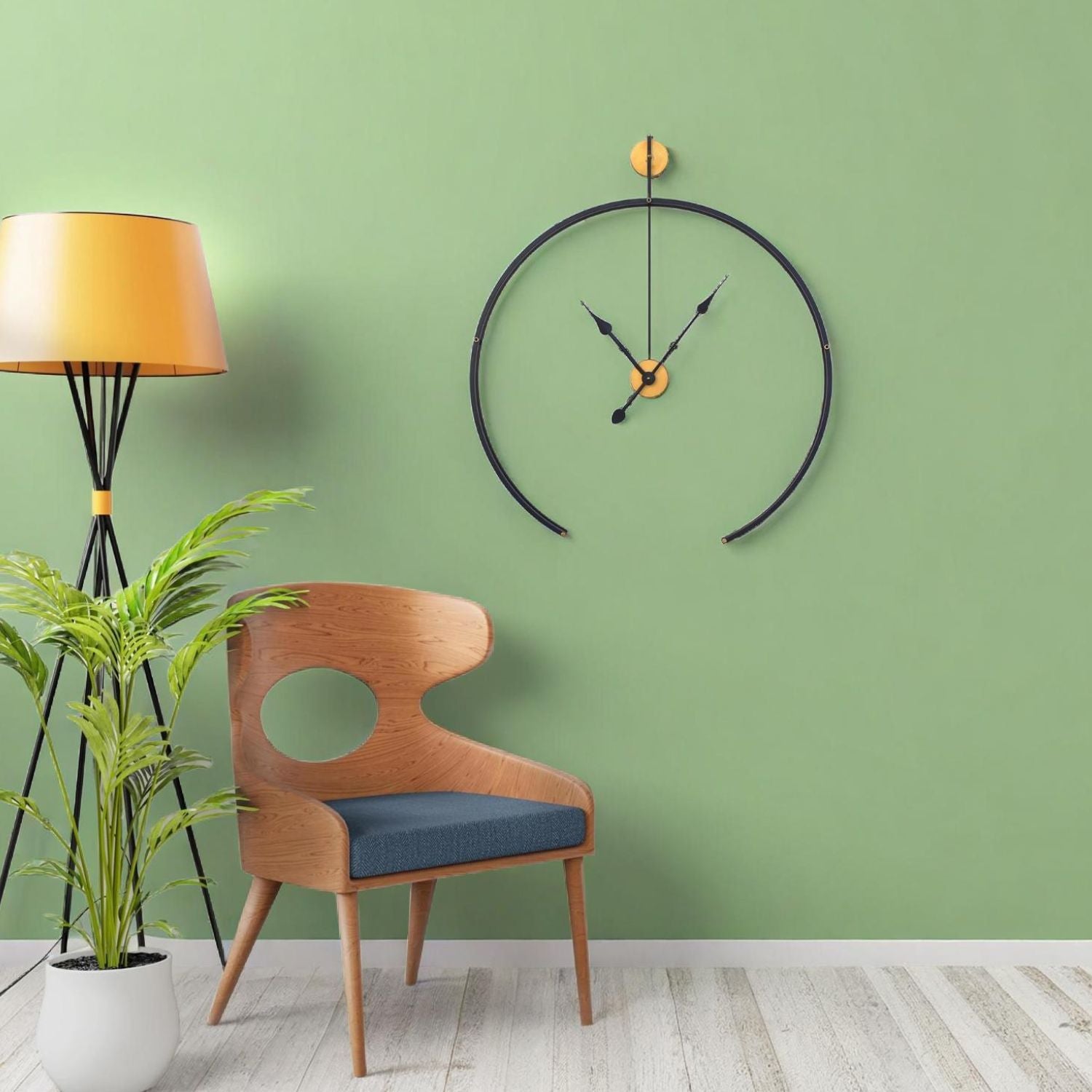 Black Metal Analog Wall Clock With Golden Centre Adding Modern Elegance