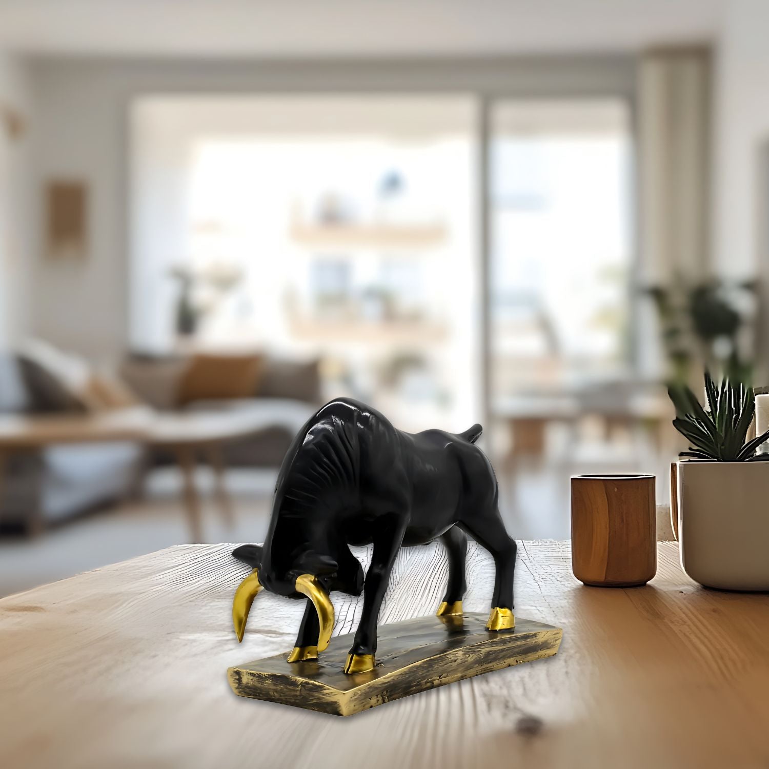 Elegant Black Bull Statue With Gold Accents on Luxurious Display Base