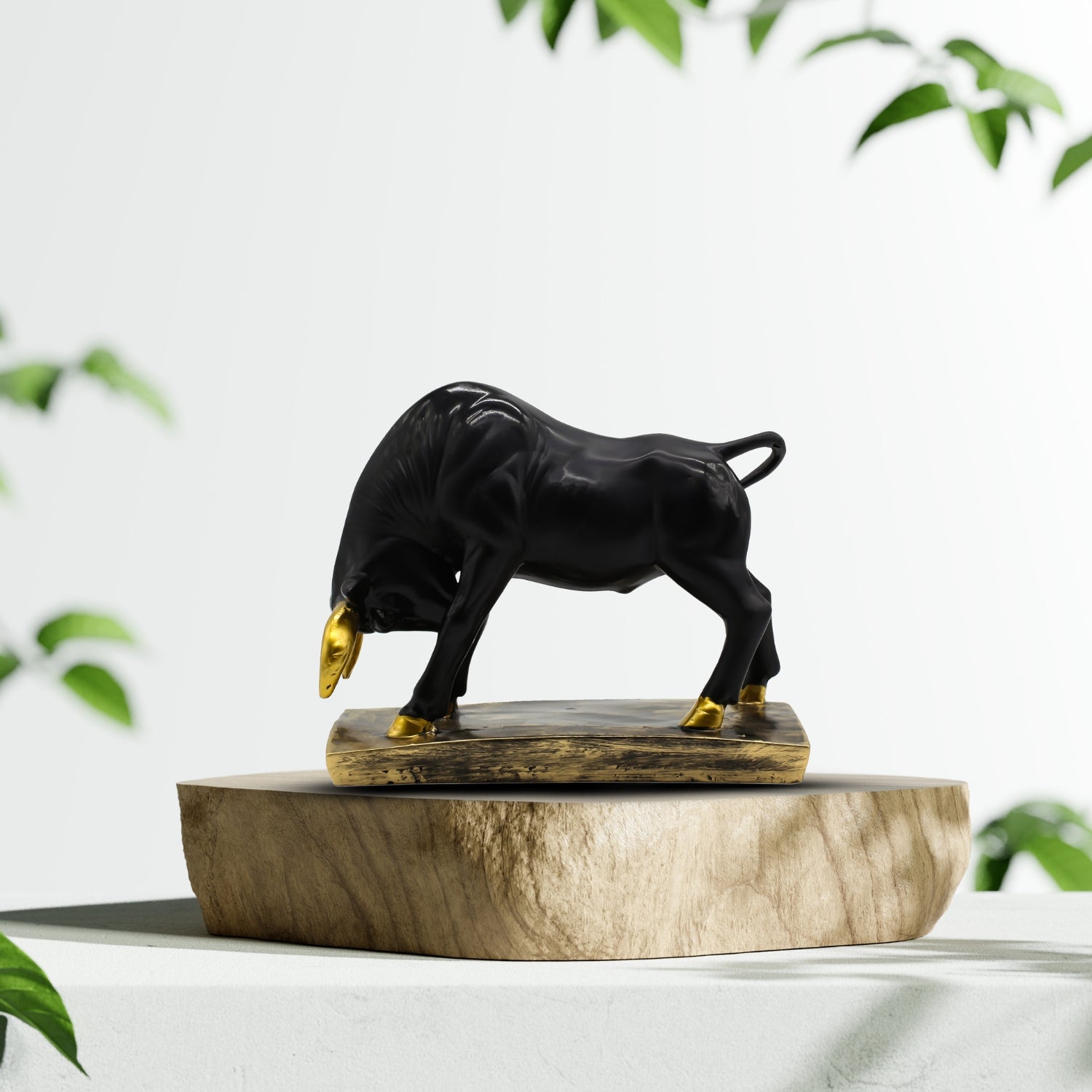 Elegant Black Bull Statue With Gold Accents on Luxurious Display Base
