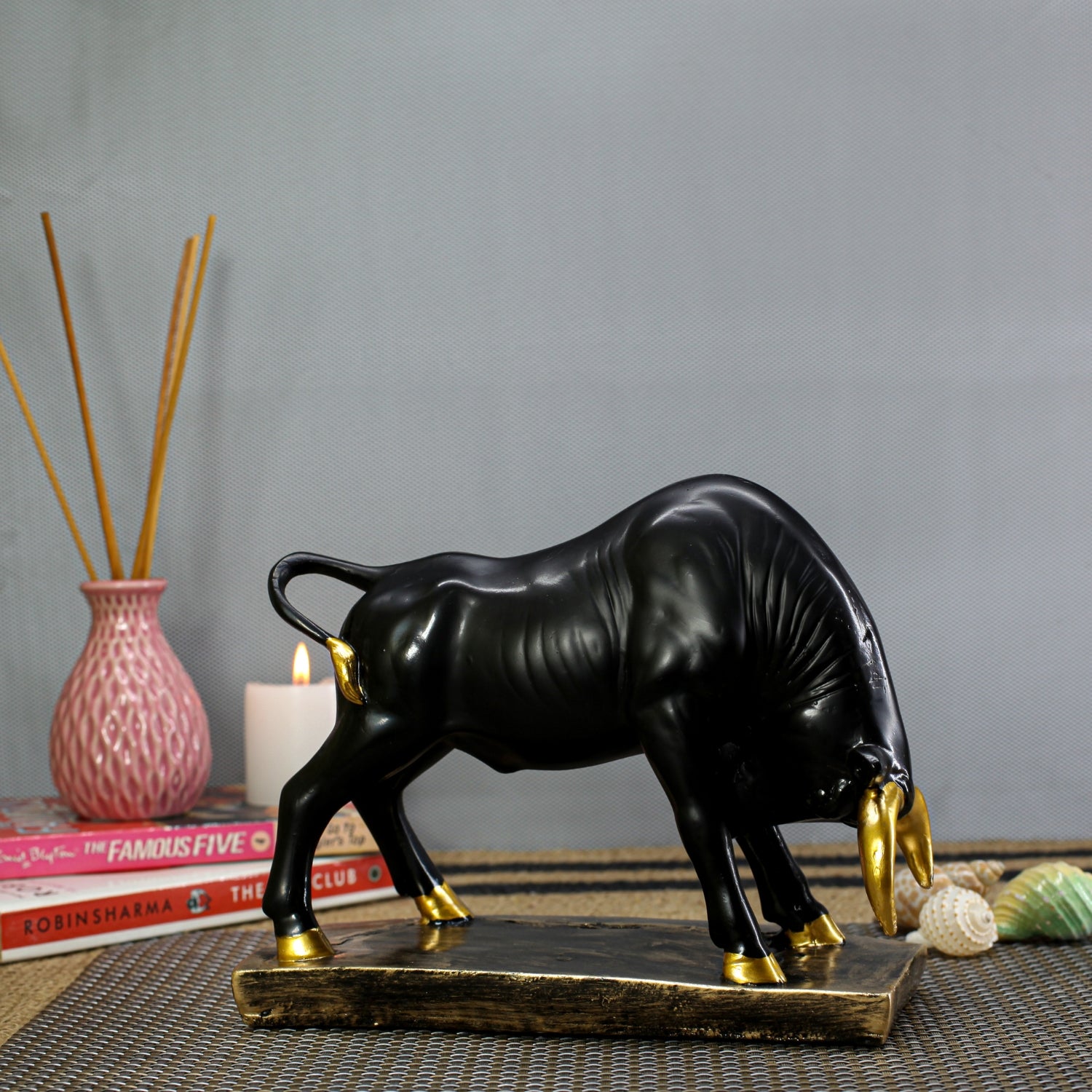 Elegant Black Bull Statue With Gold Accents on Luxurious Display Base