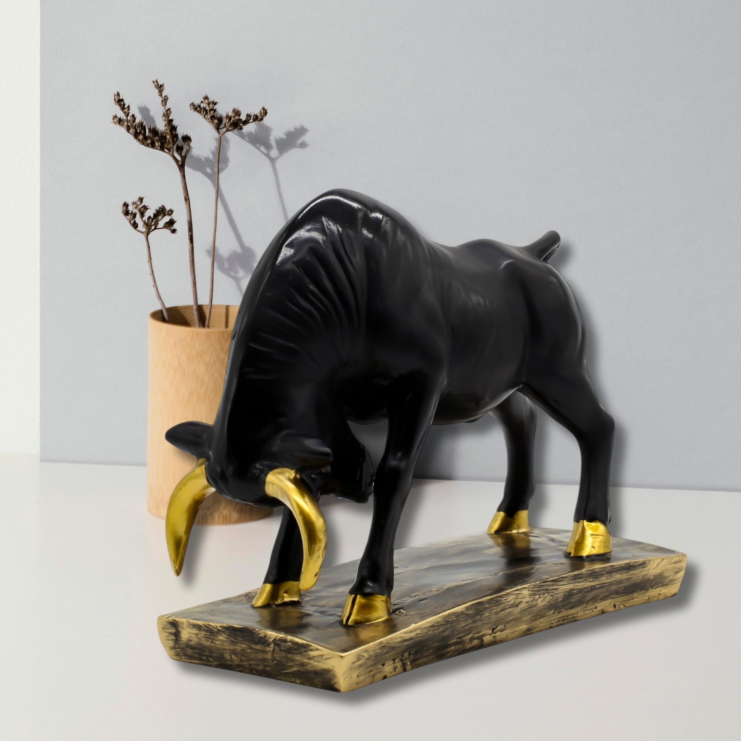 Elegant Black Bull Statue With Gold Accents on Luxurious Display Base