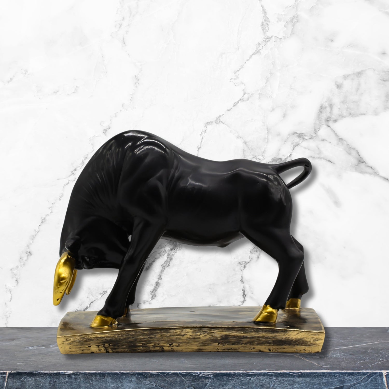 Elegant Black Bull Statue With Gold Accents on Luxurious Display Base
