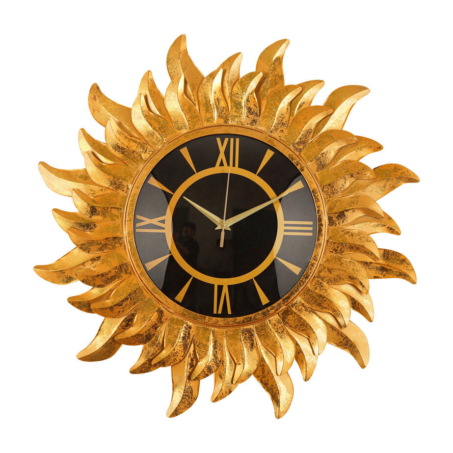 Golden Sunburst Wall Clock with Roman Numerals and Black Dial